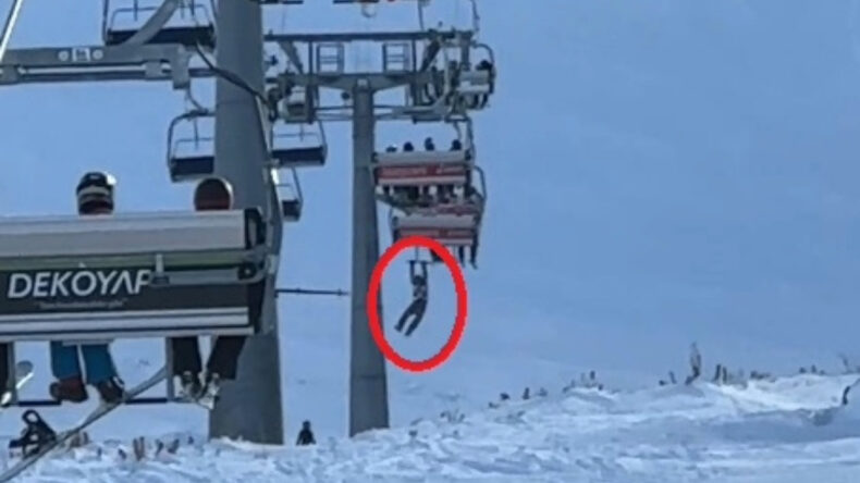 D&uuml;şen Snowboardını Almak İ&ccedil;in Atlamaya &Ccedil;alıştığı Telesiyejde Asılı Kaldı