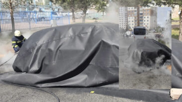 Yanan elektrikli otomobile battaniyeli m&uuml;dahale